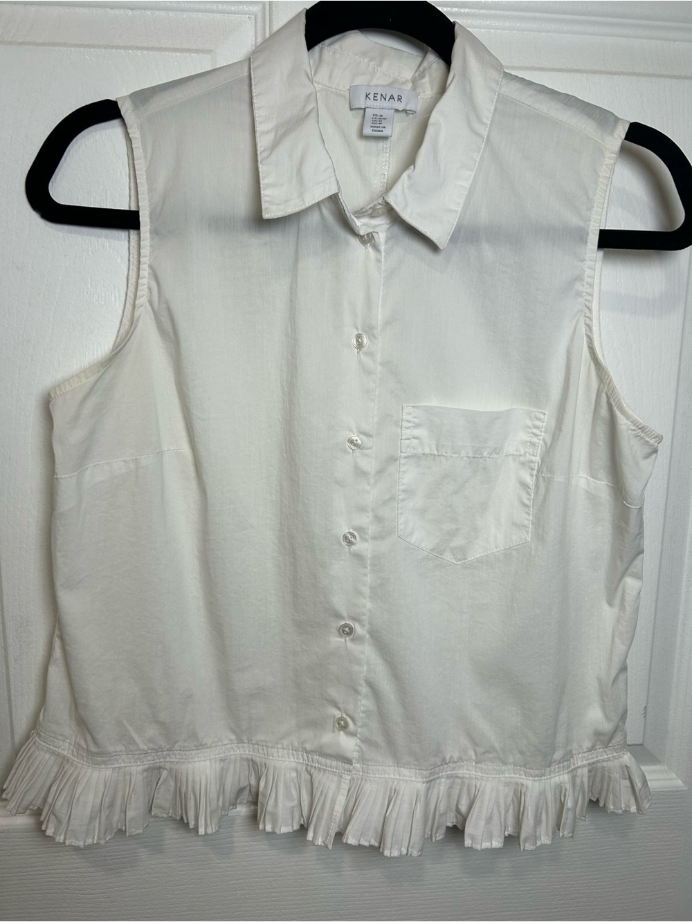 Kenar White Sleeveless Button-Down Top with Ruffle Hem